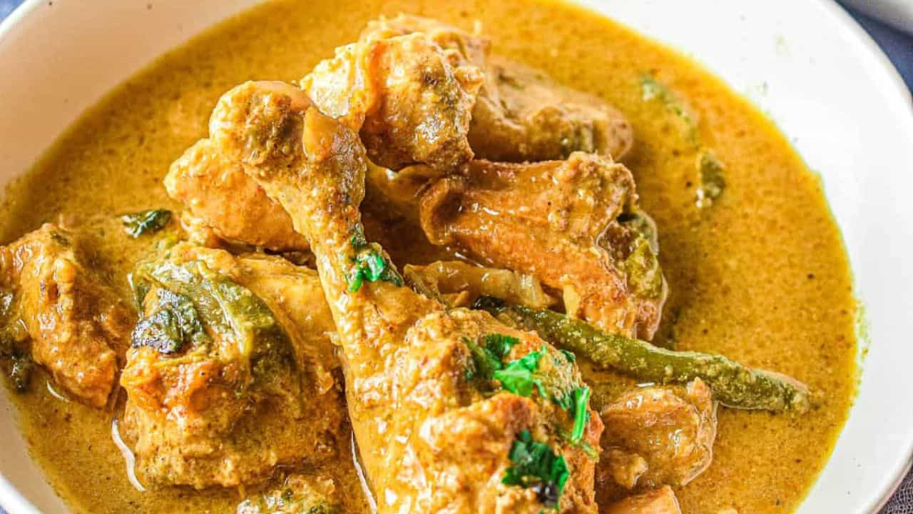 Low angle shot of bowls of chicken korma.