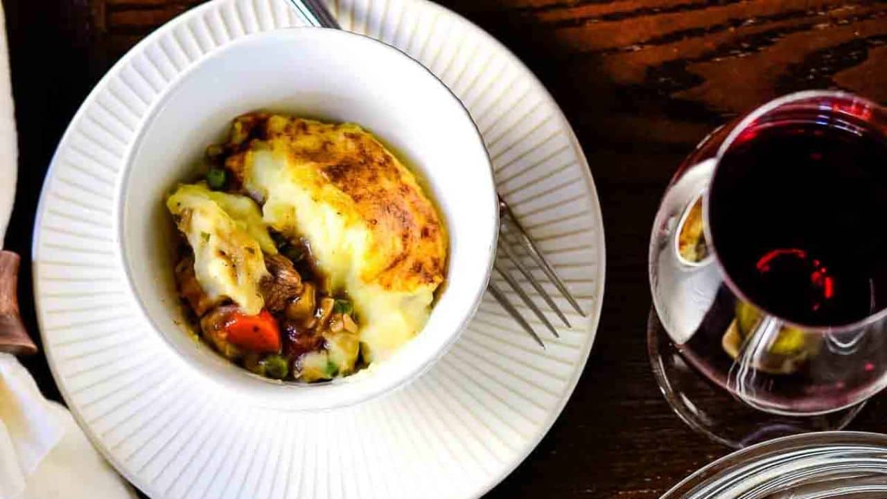 A lamb shepherd's pie served in a glass dish.