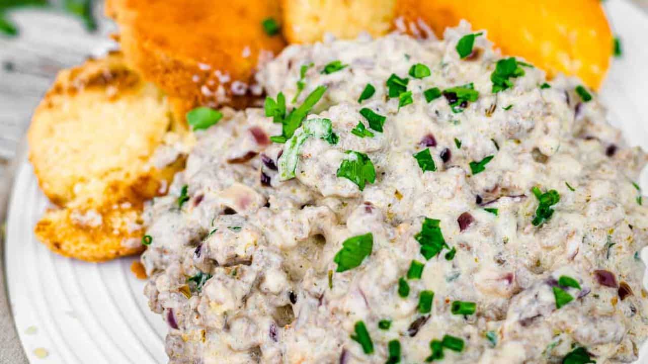 Keto gravy on a plate with biscuits.