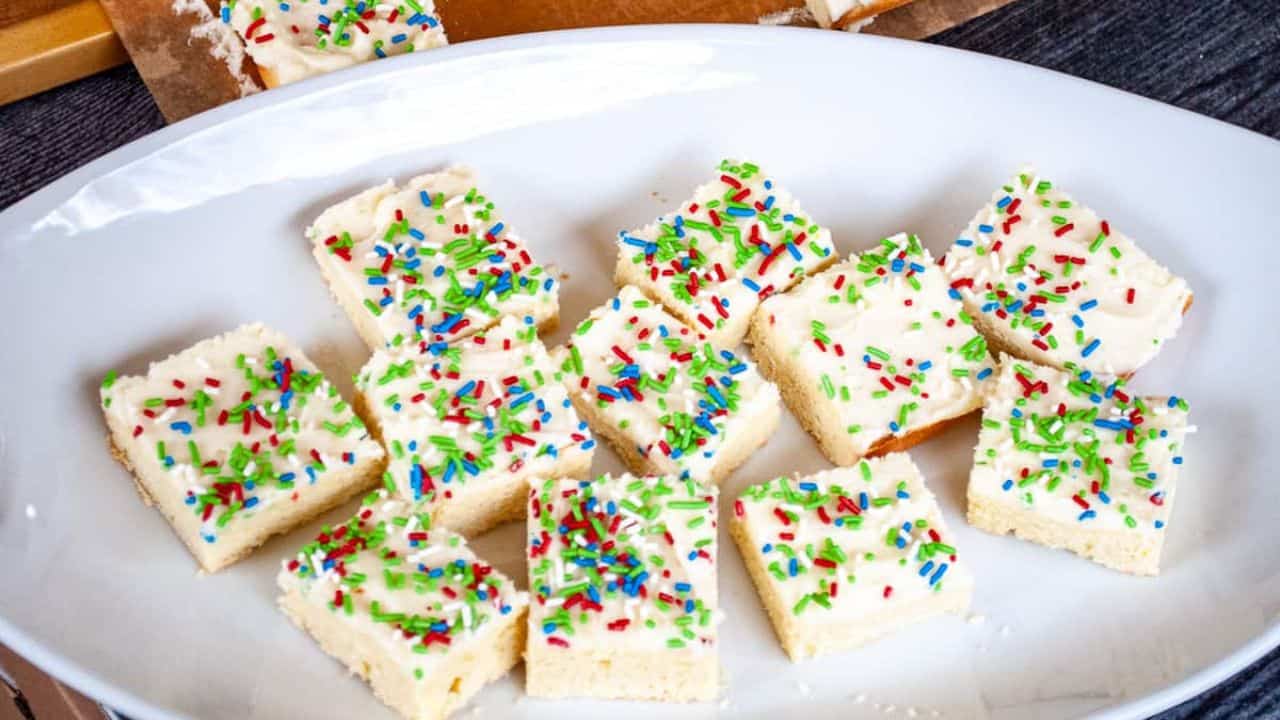 Slices of sugar cookies topped with colorful sprinkles.