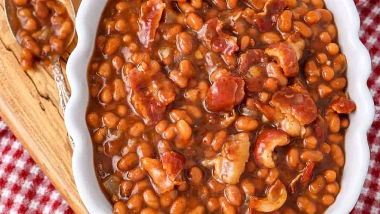 A slow cooker filled with Boston baked beans ready to be served.
