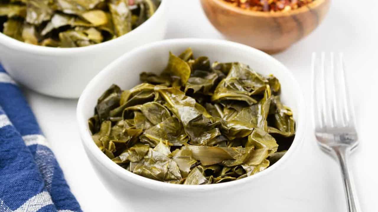 A close up image of slow cooker collard greens in a bowl.