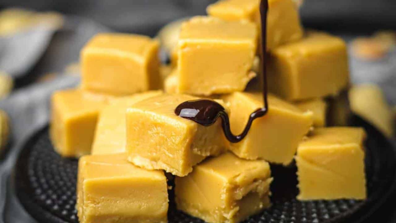 Peanut Butter Fudge on a black plate.