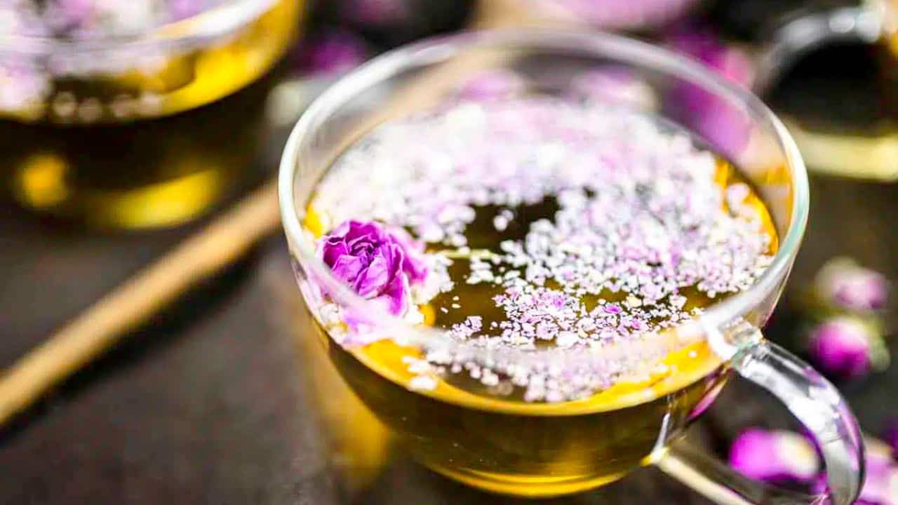 A glass cup filled with tea from roses.