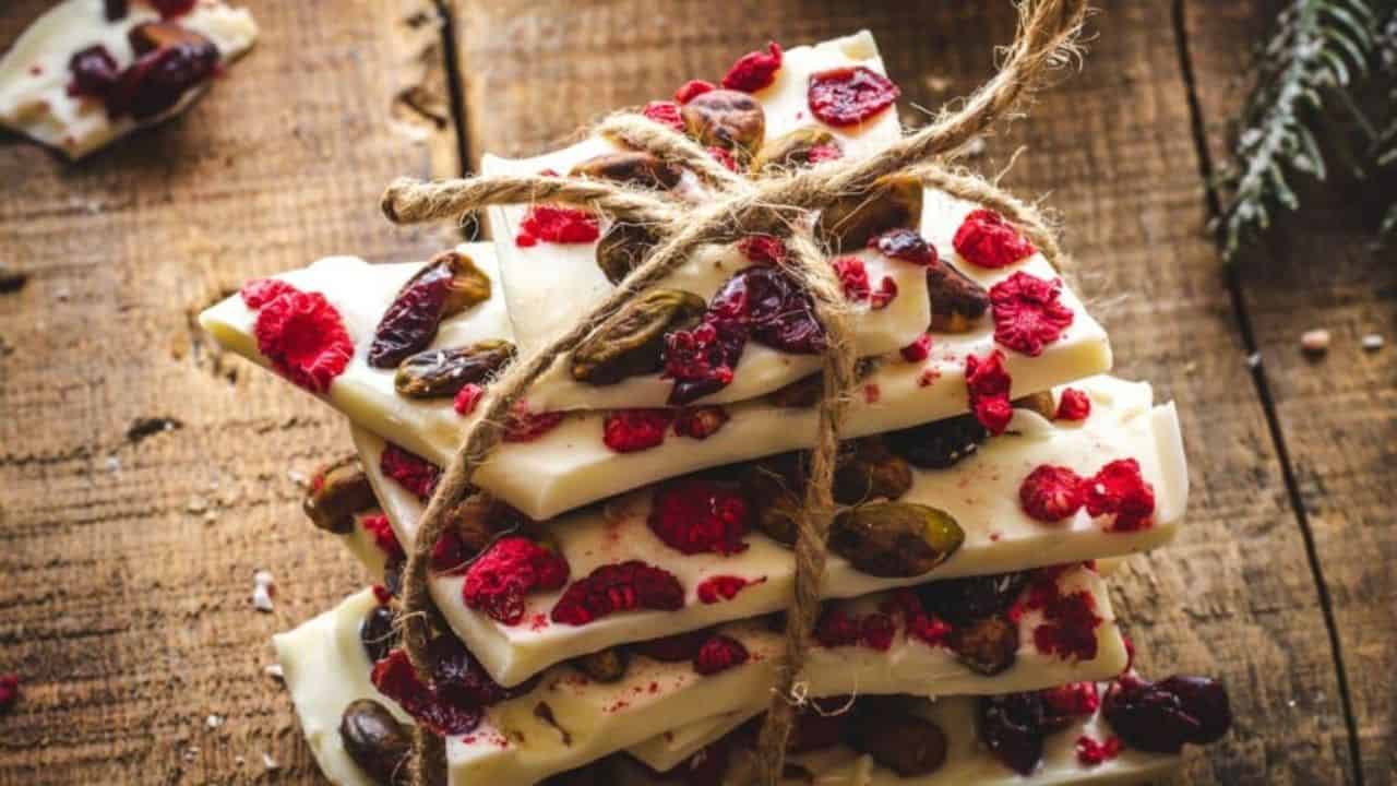 Stack of white chocolate bark wrapped in string.
