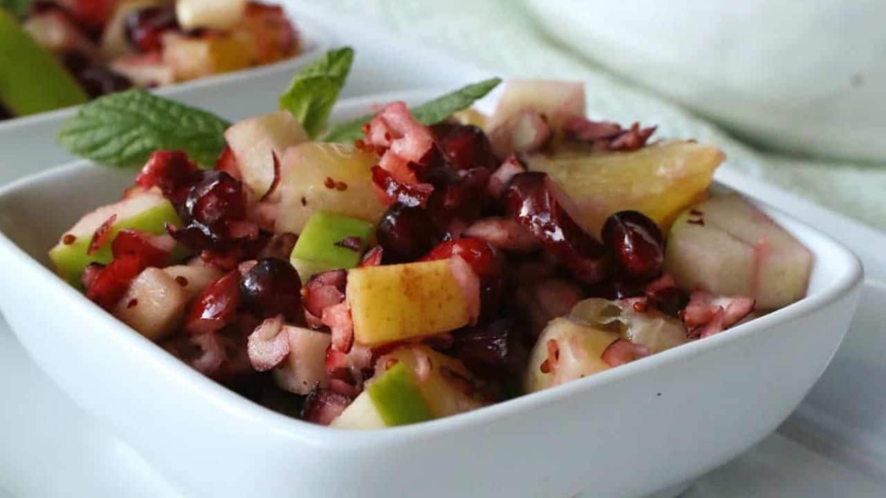 Cranberry fruit salad in white bowls.