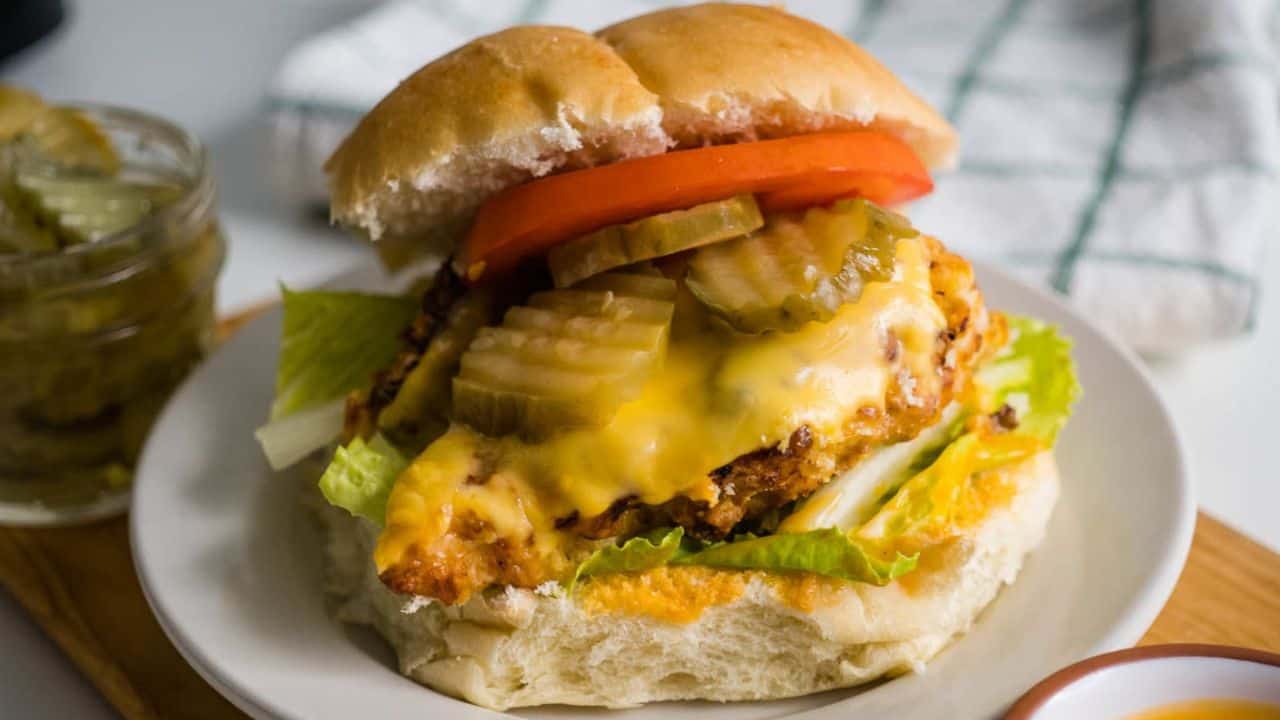 Copycat Chick-fil-A sandwich with tomato, lettuce and cheese.