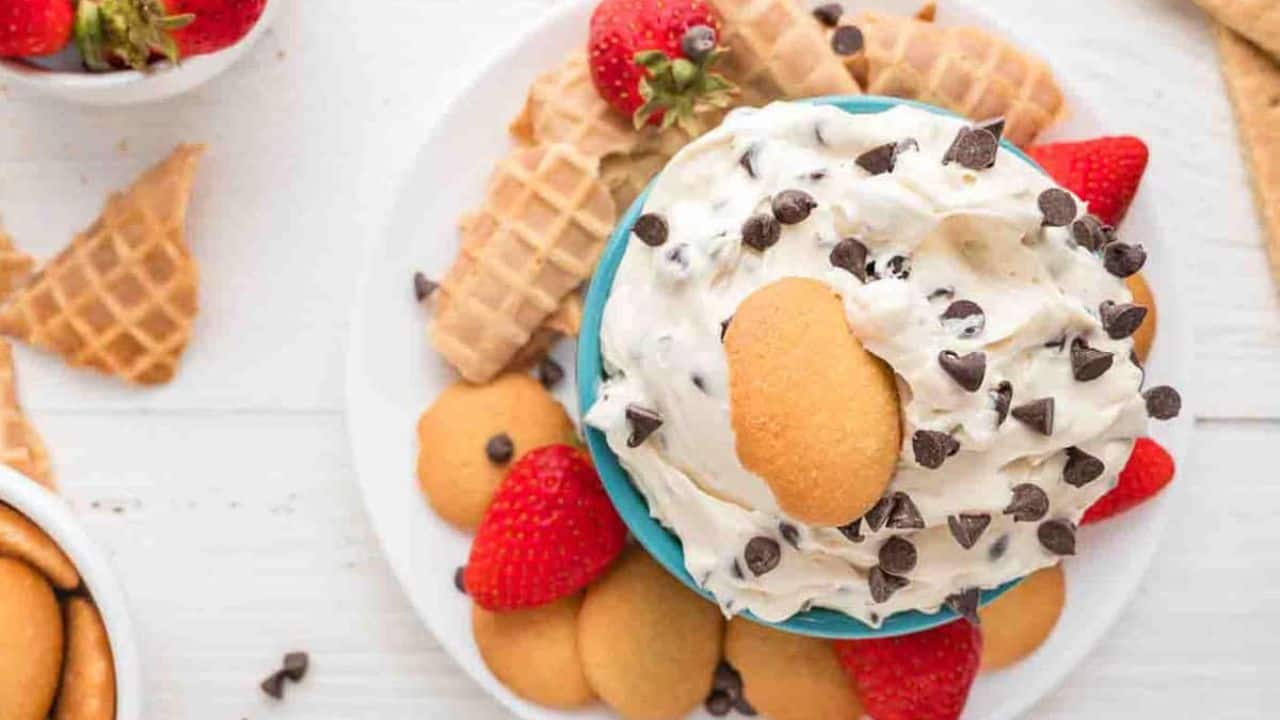 An overhead image of cookie dough dip with crackers surrounding it.