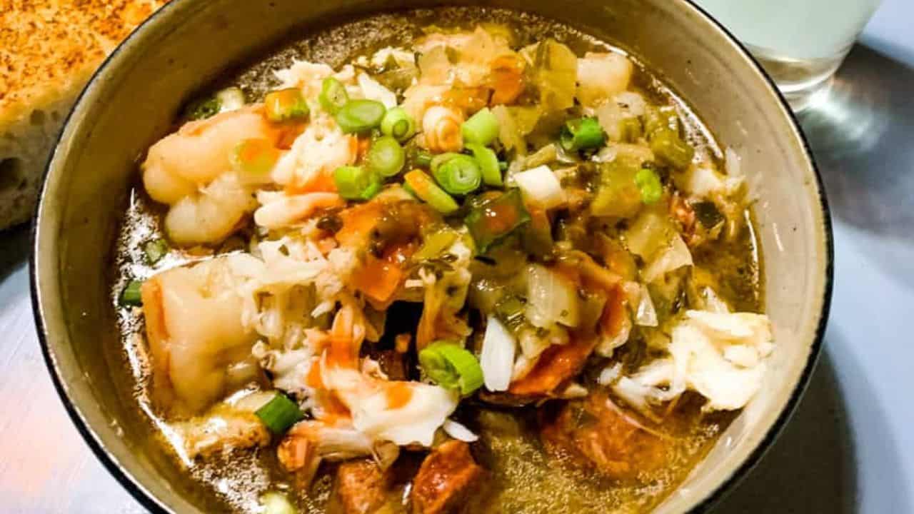 A bowl of crab, shrimp, and sausage gumbo.