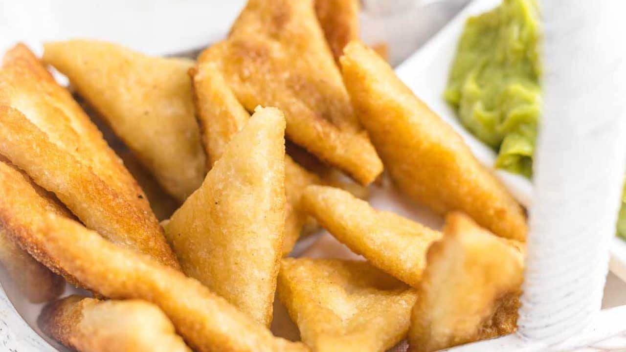 Keto Tortilla Chips with guacamole behind.