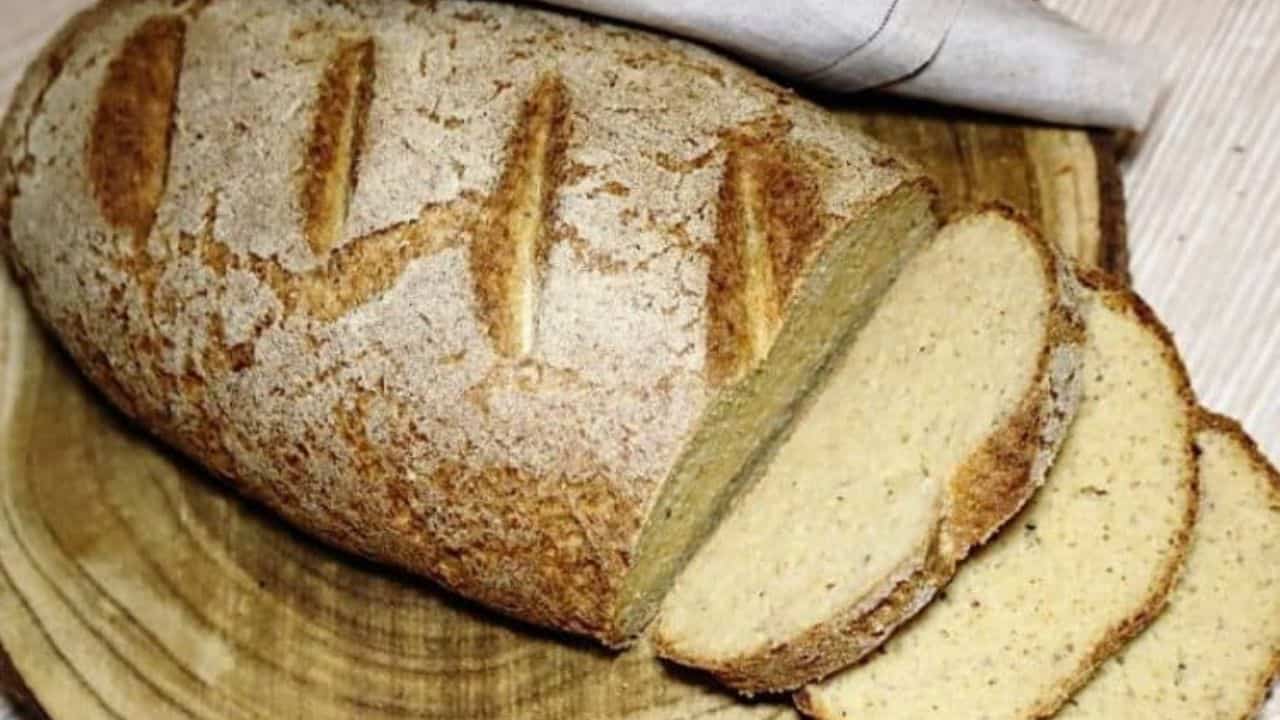 Girl holding Farmers Bread loaf.