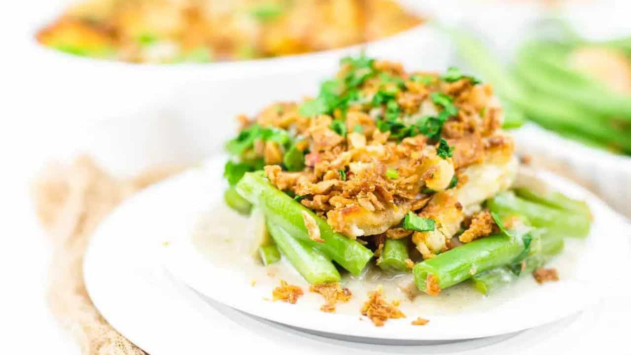 A plate of green bean mushroom casserole with fried onions.