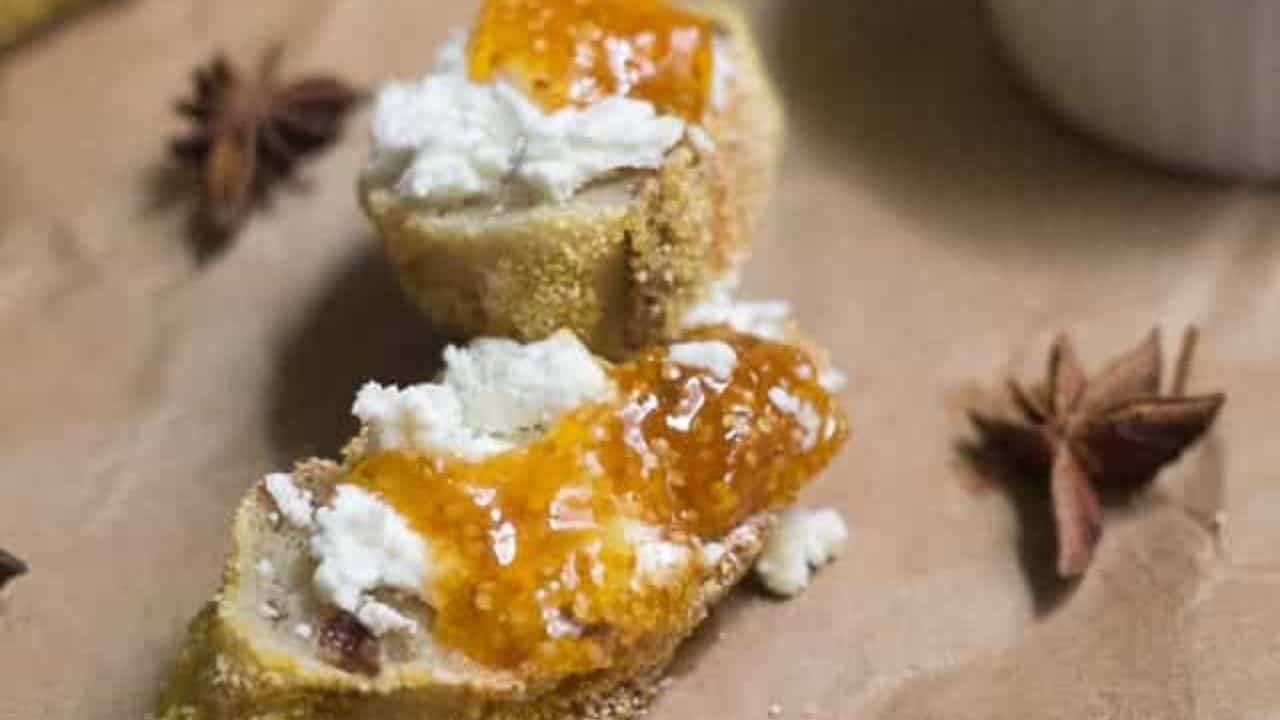 Ground cherry jam in ramekin with baguette.