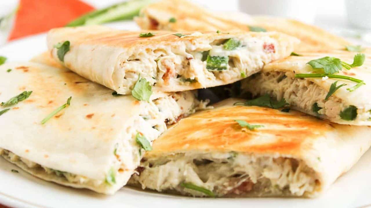 Stacked quesadillas showing cheesy filling.