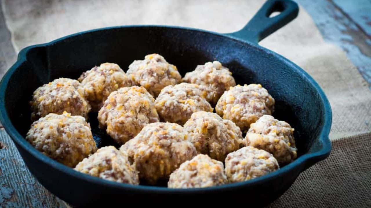 Sausage balls in a cast iron skillet.