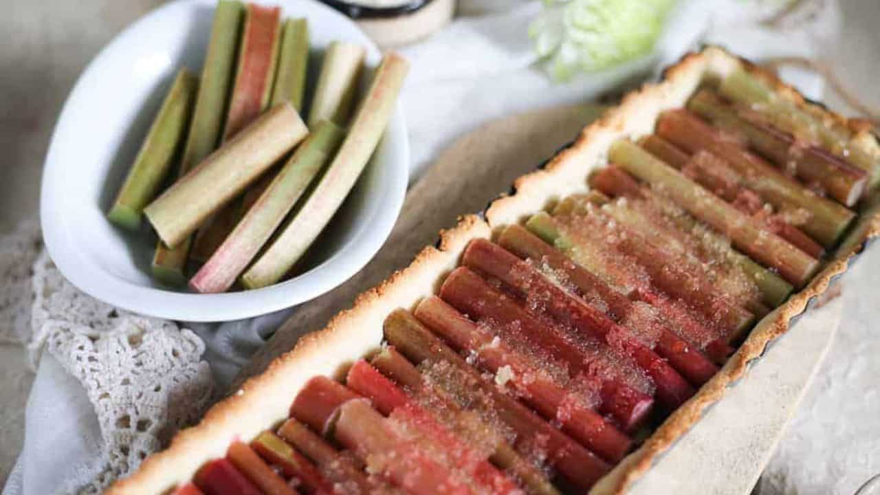 Rhubarb tart on a wooden board.