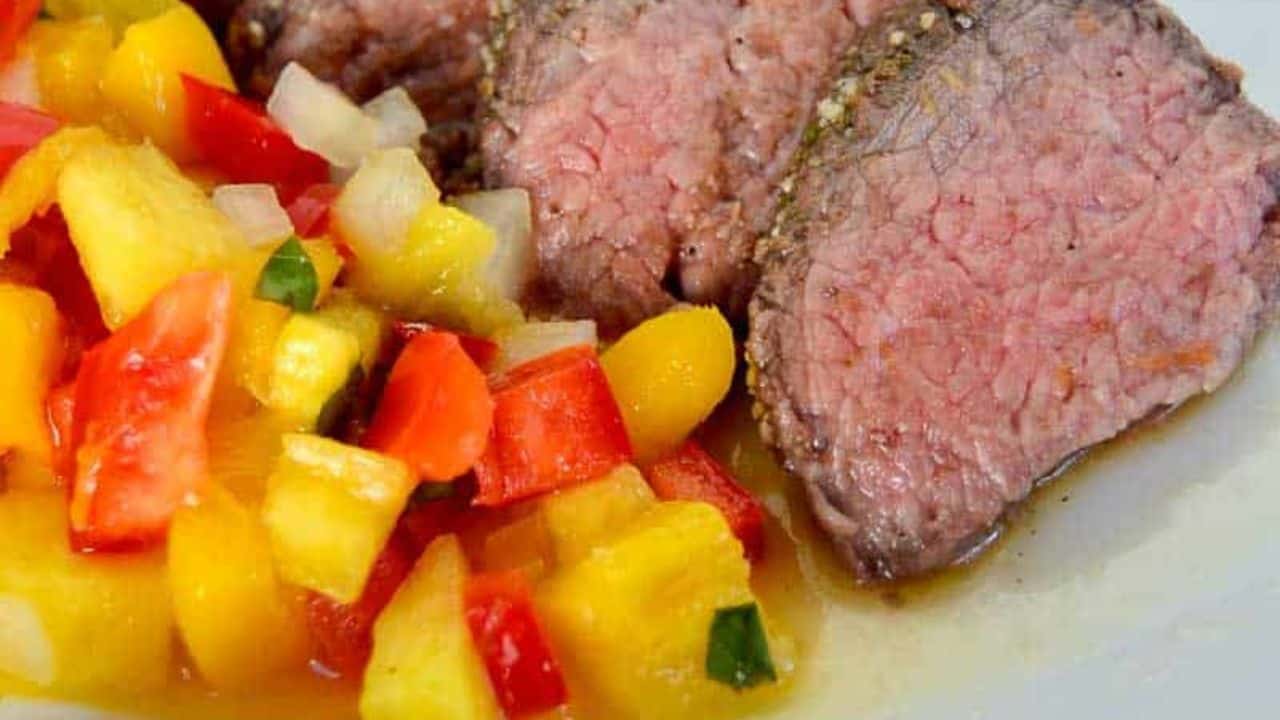 Grilled tri-tip steak sliced and topped with a colorful pineapple mango red pepper salsa.