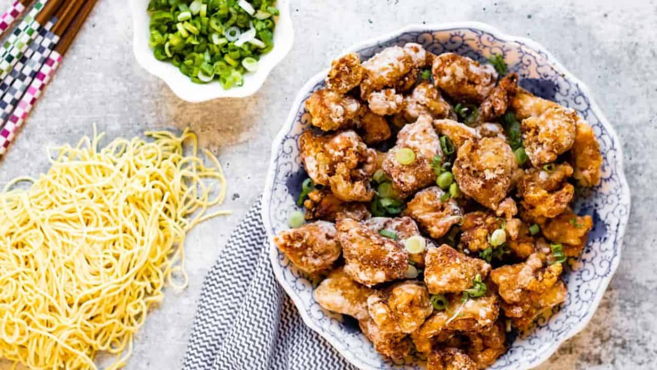 Overhead shot of karaage chicken with noodles on the side.