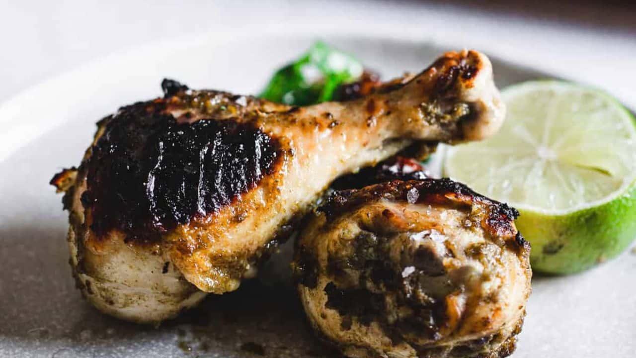 Chicken drumsticks on a plate.
