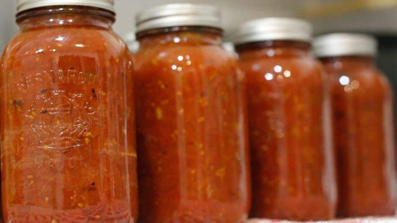 Spaghetti with tomato sauce on a white plate.