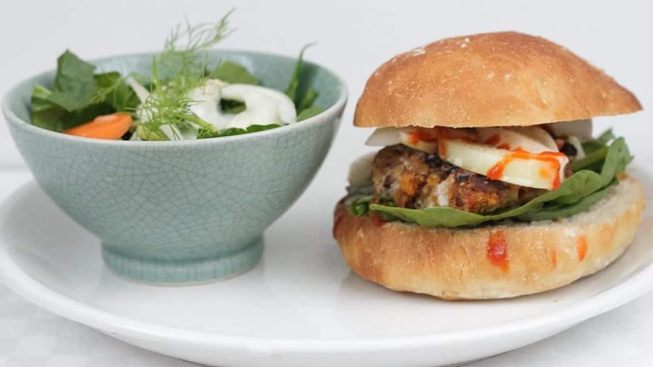 Side view of yam burger with onion.