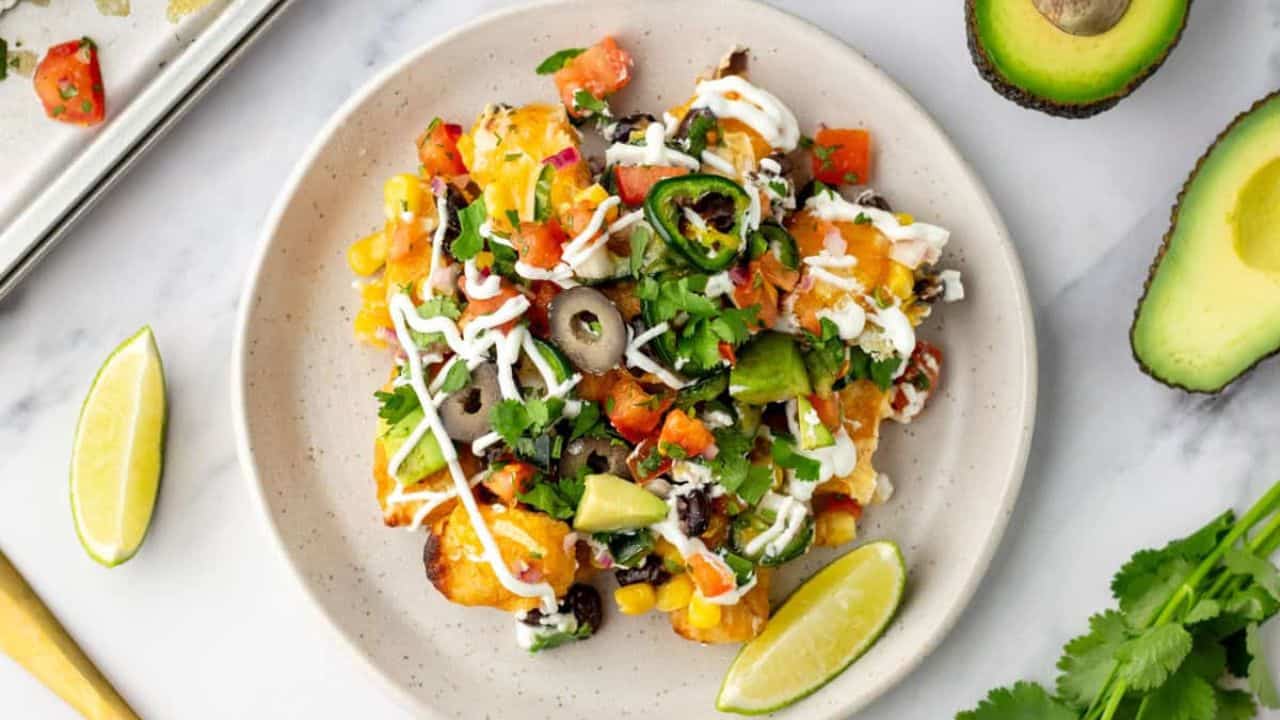 An overhead image of tater tot nachos served on a plate.