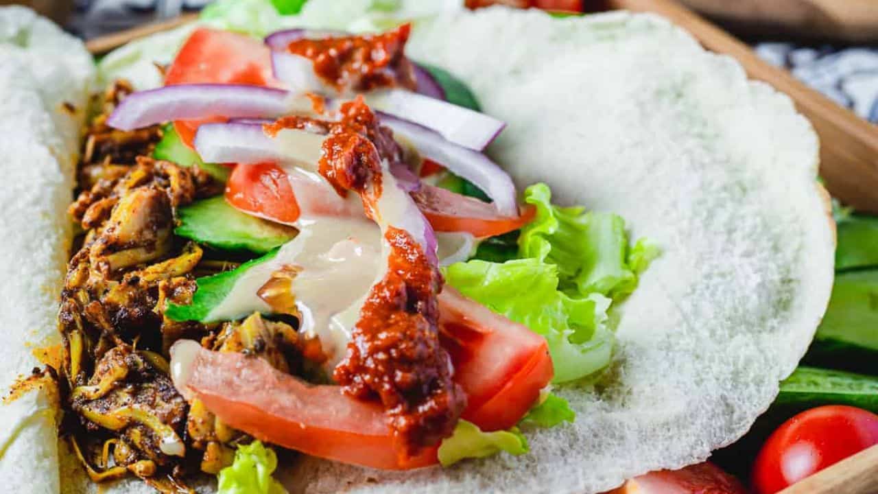 Close up view of vegan shawarma on a pita.