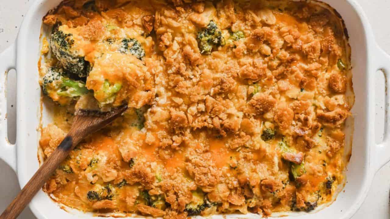 A casserole dish with broccoli and cheese in it.