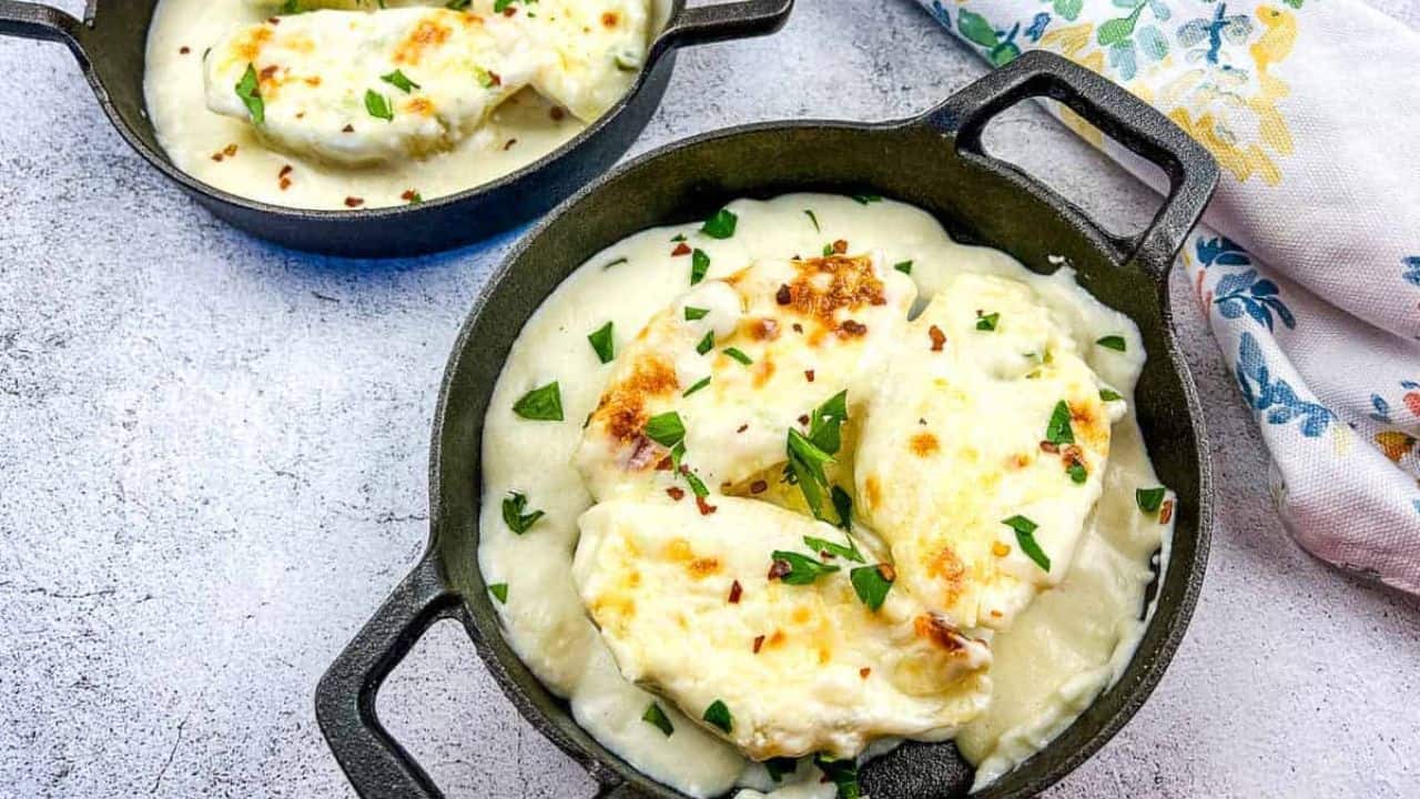 Giant Cheese Stuffed Pasta Shells in two black serving dishes.