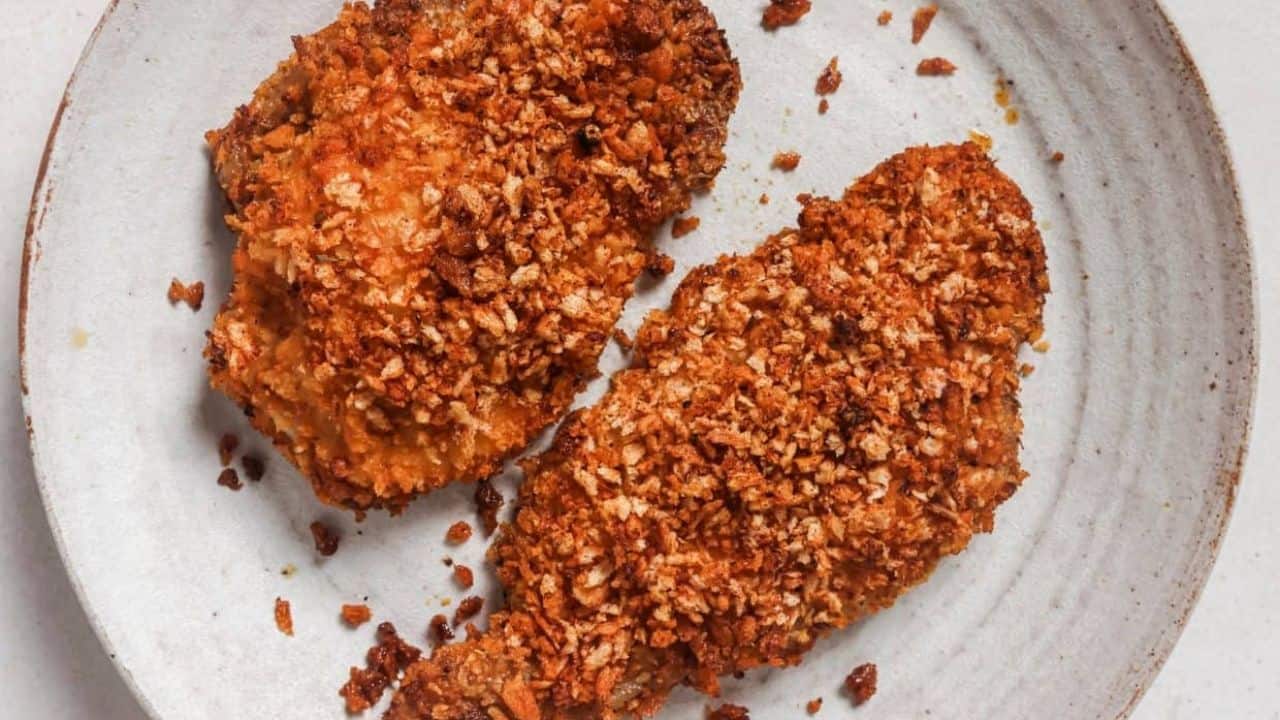 Two shake and bake pork chops on a plate.