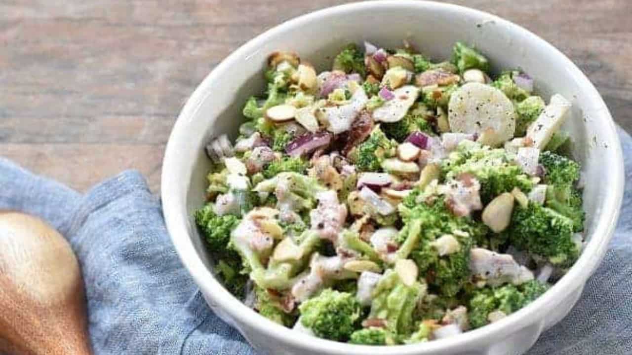 A bowl of broccoli salad with bacon.