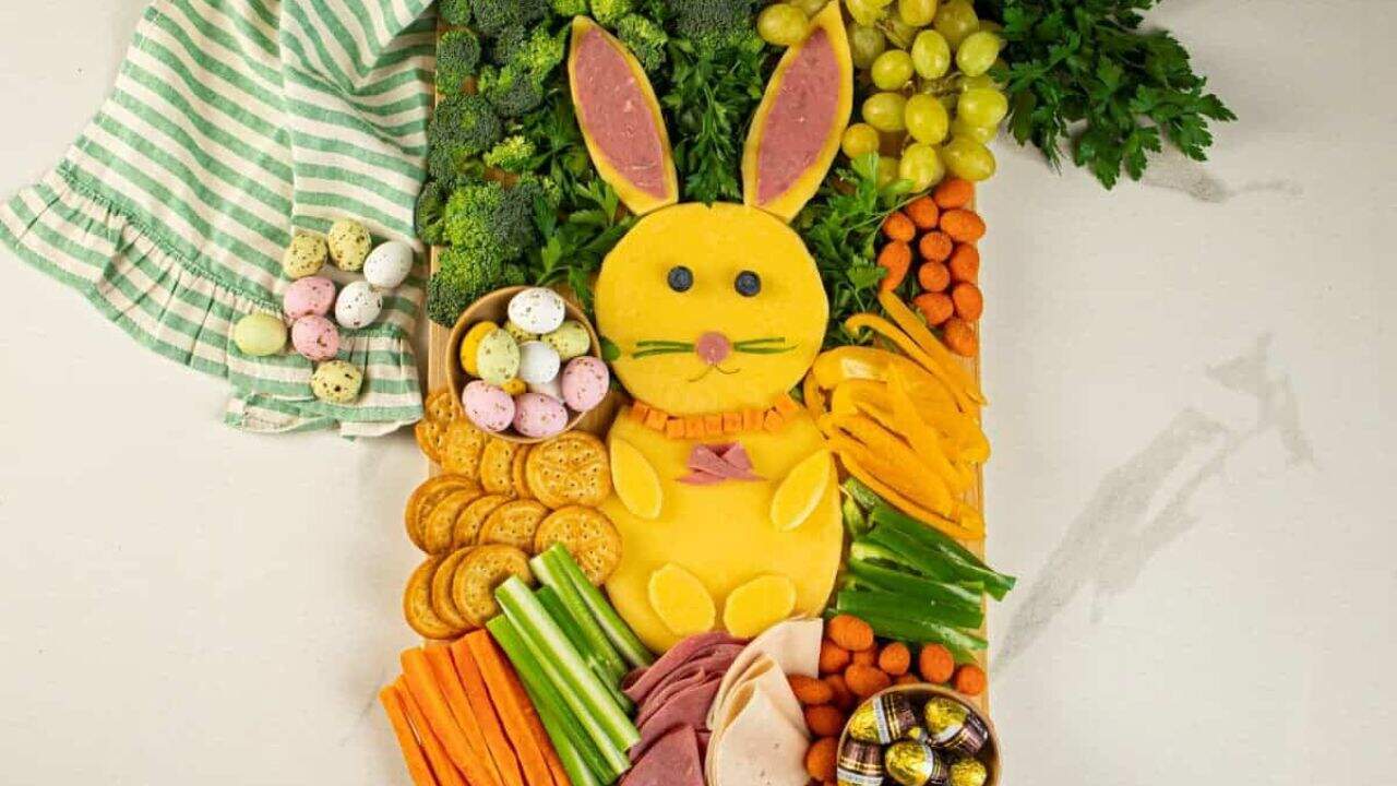 An Easter bunny charcuterie board with a towel at the top.