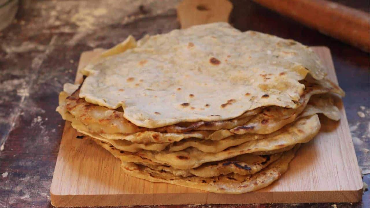 Sourdough tortillas in cast iron skillet.